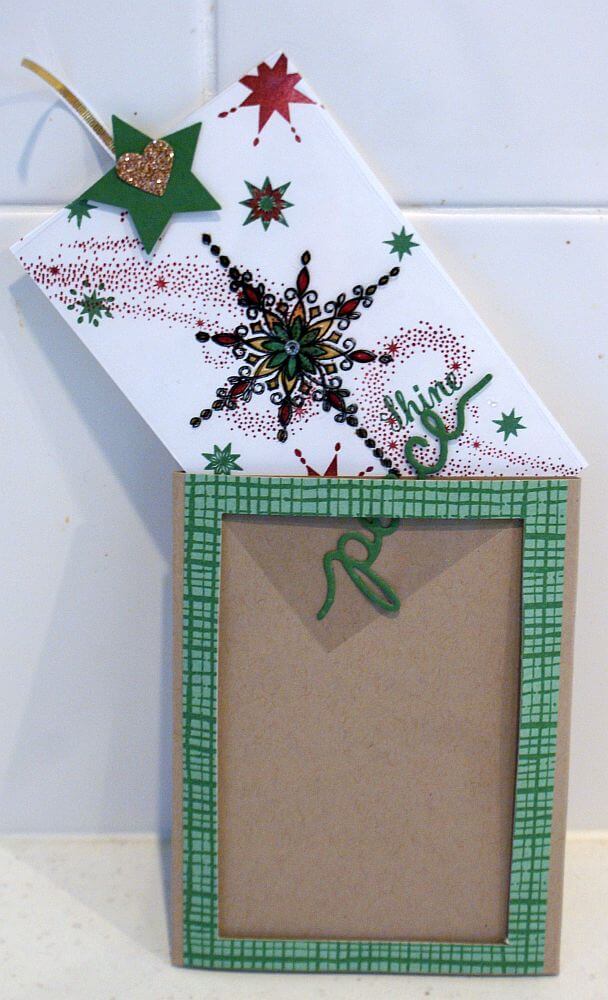 This picture shows how the plain magic card front becomes a colourful one. There's a tutorial on this page to show you how to make your own. Christmas Magic Card