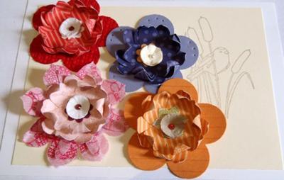 More embossed or pierced paper flowers