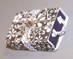 The altered matchbox, all closed and looking pretty. See PaperCraftCentral.com for a tutorial on how to make altered matchboxes. Closed finished matchbox