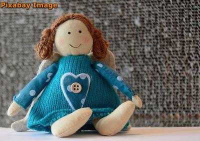 Example of a fabric doll with embroidered face